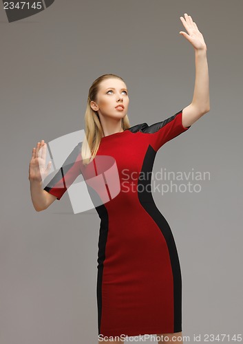 Image of woman working with something imaginary