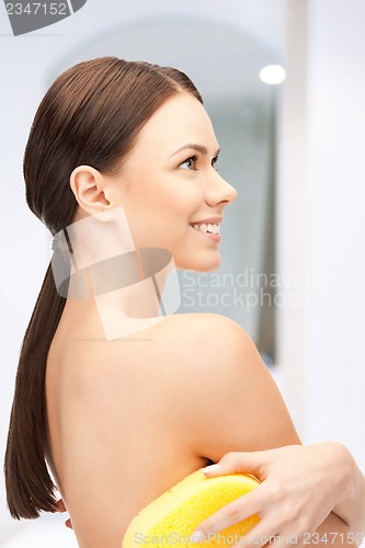 Image of beautiful woman with sponge