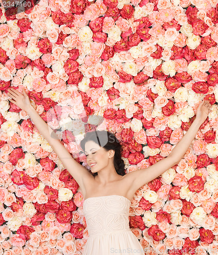 Image of young woman with background full of roses