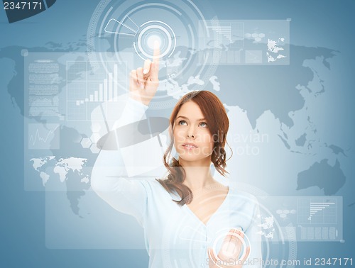 Image of businesswoman touching virtual screen