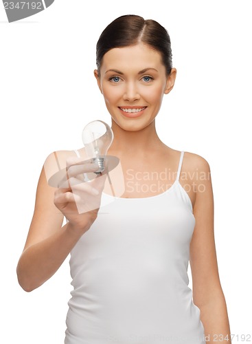 Image of woman with energy saving bulb