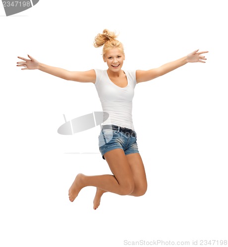 Image of jumping teenage girl in blank white t-shirt
