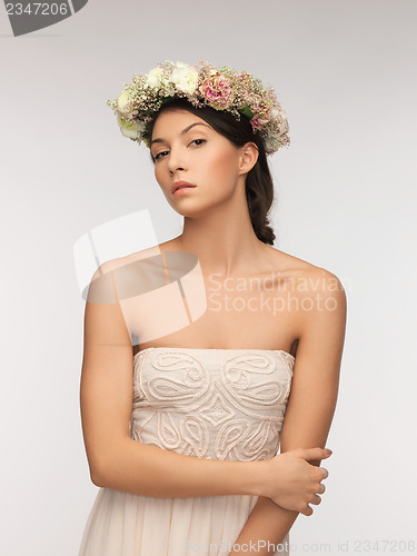 Image of woman wearing wreath of flowers