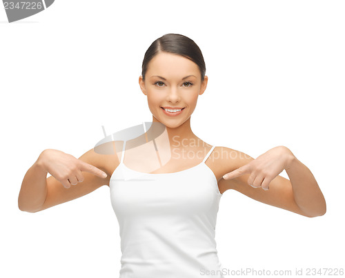 Image of woman in blank white t-shirt pointing at herself