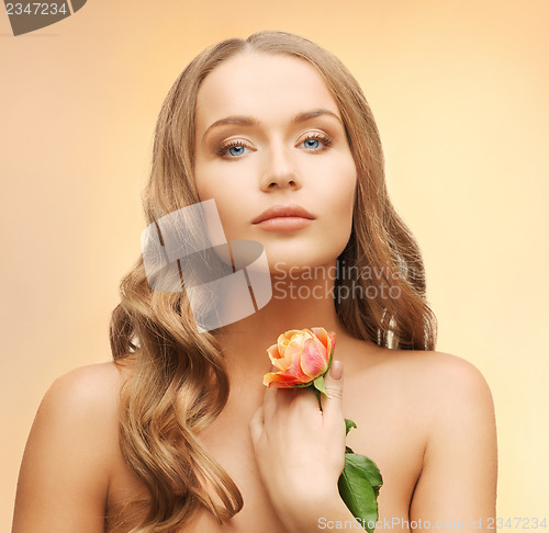 Image of lovely woman with rose flower