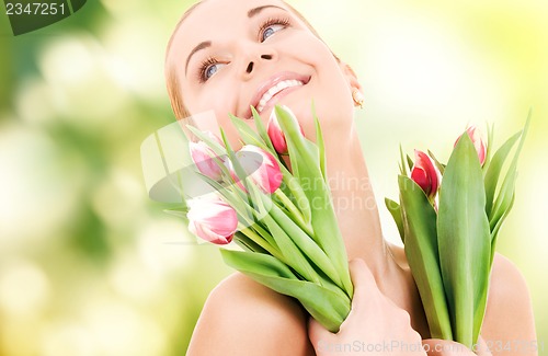 Image of happy woman with flowers