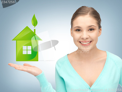 Image of woman showing light bulb on the palm of her hands