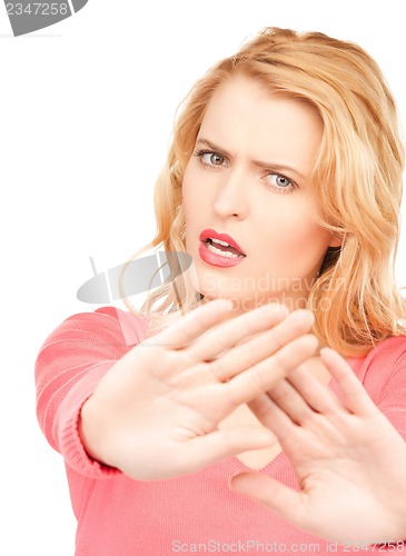 Image of woman making stop gesture