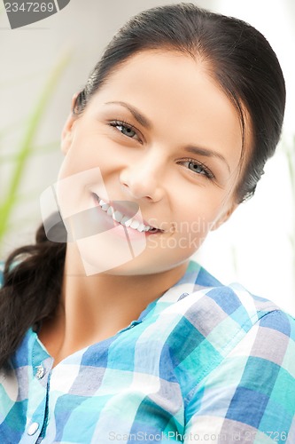 Image of picture of smiling woman at home