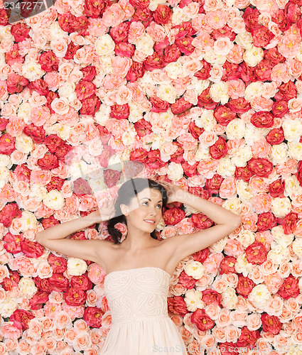 Image of young woman with background full of roses