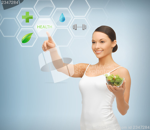 Image of woman with salad and virtual screen