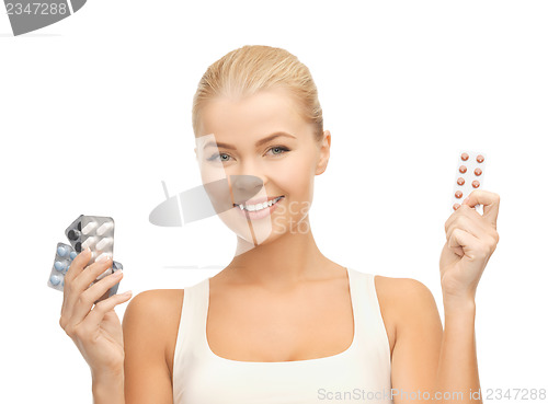 Image of young woman with pills