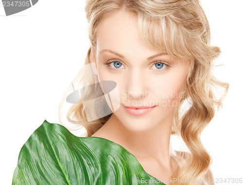 Image of woman with green leaf