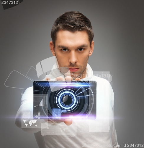 Image of futuristic man with gadget