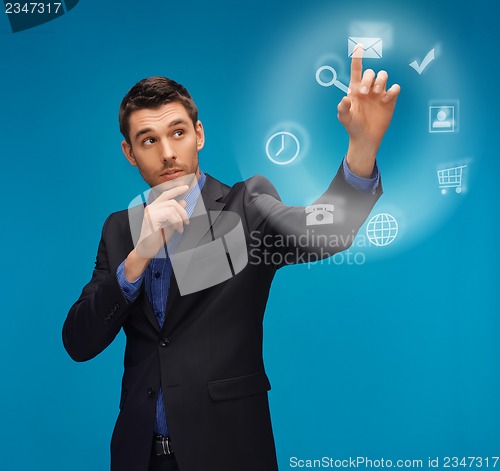 Image of man in suit working with something imaginary