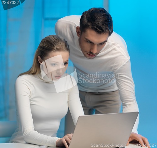 Image of man and woman in laboratory