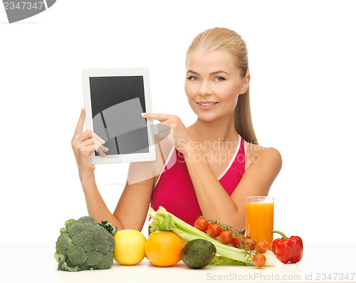 Image of woman with fruits, vegetables and tablet pc