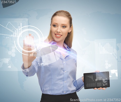 Image of woman working with tablet pc and virtual screen