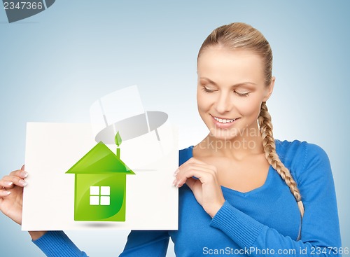 Image of woman with illustration of green eco house