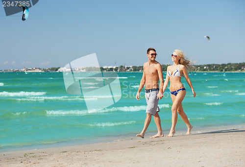 Image of couple walking on the beach