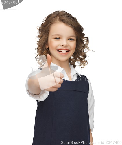 Image of pre-teen girl showing thumbs up