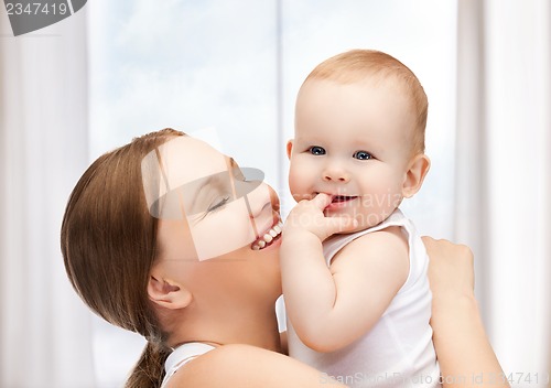 Image of happy mother with adorable baby