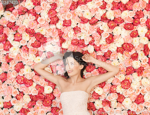 Image of young woman with background full of roses