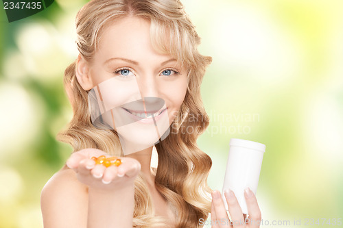 Image of young woman with pills