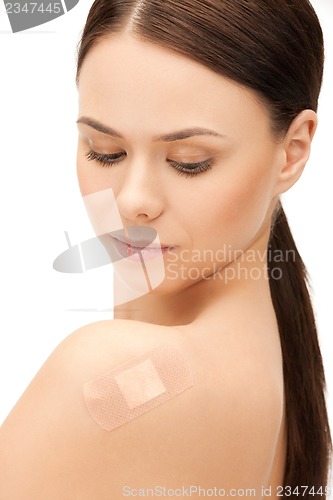 Image of beautiful woman with medical patch or plaster