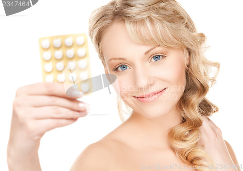 Image of woman with pills