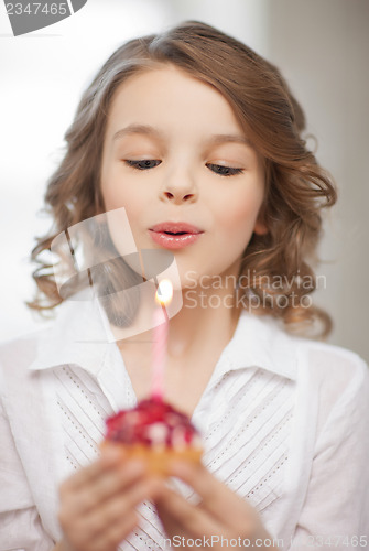 Image of girl with cupcake