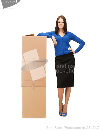 Image of businesswoman with big carton boxes