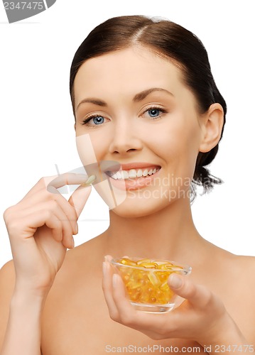 Image of woman with vitamins