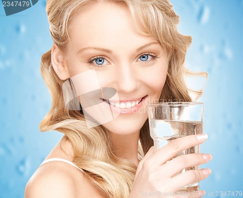 Image of woman holding glass of water