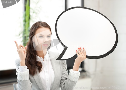 Image of businesswoman holding blank text bubble