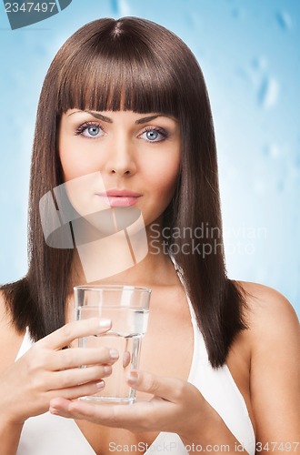 Image of woman holding a glass of water