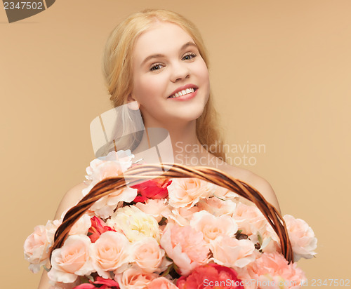 Image of woman with basket full of flowers