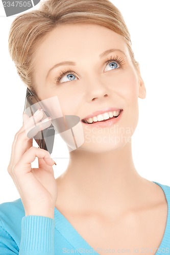 Image of businesswoman with cell phone calling