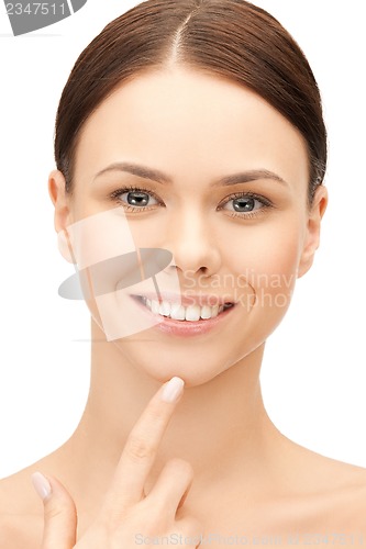 Image of woman touching her chin