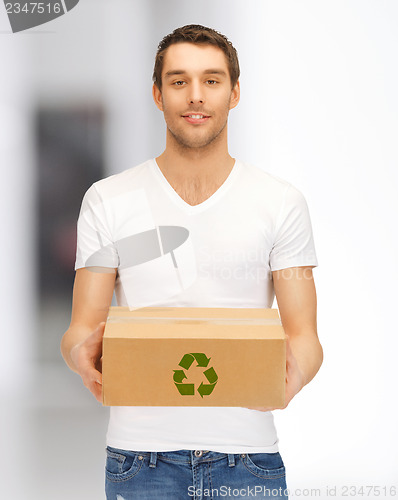 Image of handsome man with recyclable box