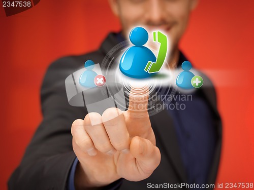 Image of man pressing contact icon