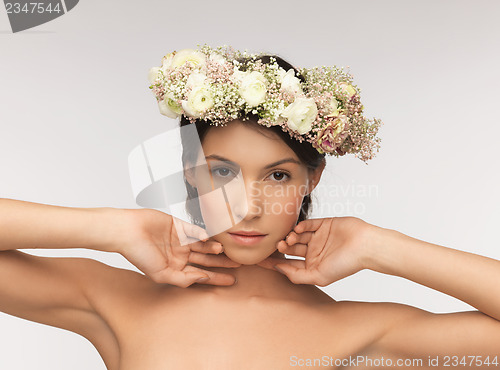 Image of woman wearing wreath of flowers