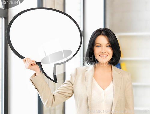 Image of smiling businesswoman with blank text bubble