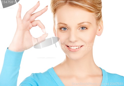 Image of young woman showing ok sign