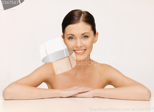 Image of face and hands of beautiful woman