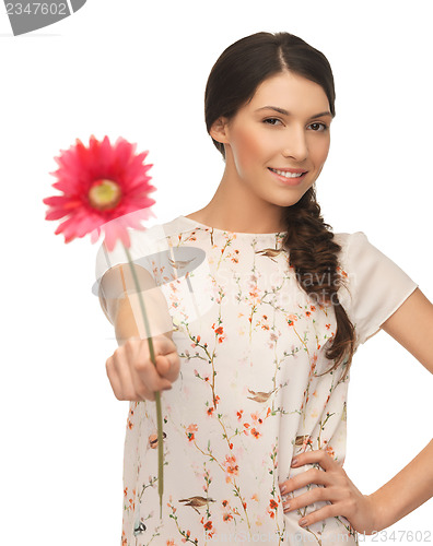 Image of young and beautiful woman with flower