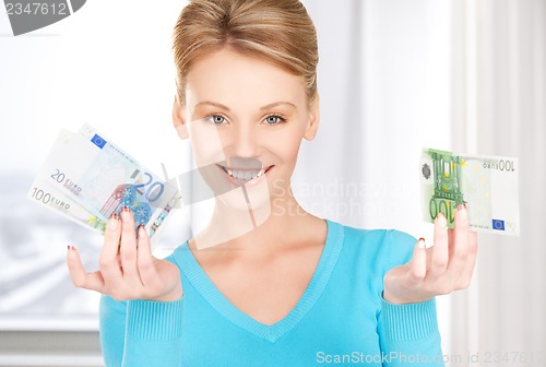 Image of smiling woman with money
