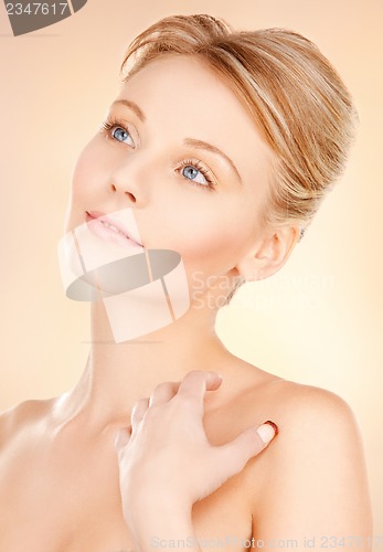 Image of face and hands of beautiful woman