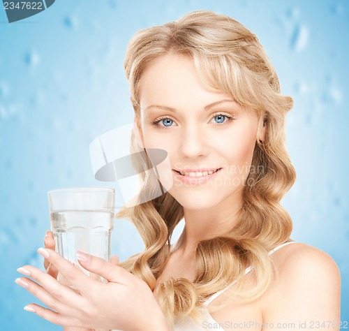 Image of woman holding glass of water