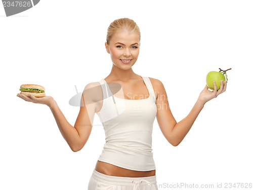 Image of woman with apple and hamburger